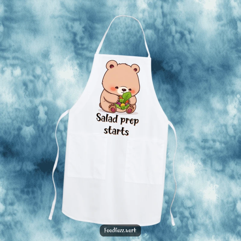 Funny bear cub apron with a cub looking at a small salad, ideal for kitchen humor and cooking enthusiasts.