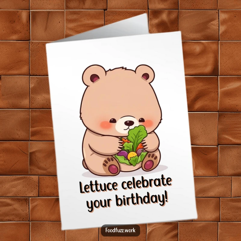 Funny free printable birthday card: A plump bear cub curiously examines a single leaf on a tiny salad, looking bewildered.