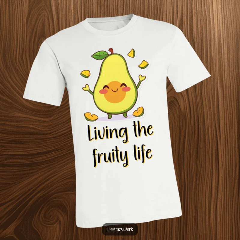 Funny T-Shirt of a smiling avocado character happily juggling tiny fruit slices, symbolizing fun, health, and humorous energy.